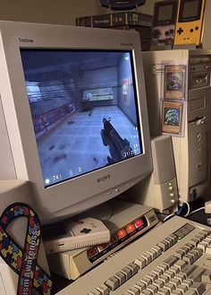 a computer monitor sitting on top of a desk next to a keyboard and mouse,