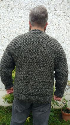 "My Irish Fisherman Sweater is made with 100% pure unprocessed and not dyed wool yarn - natural breathable fibre. A true wardrobe essential this fisherman sweater will keep you comfortable and warm against the elements year after year. Because yarn used is unprocessed, wool still got `oil` in its fibre, that makes my sweaters water repelliant. Knit is inspired on medieval pattern \"dragon scale\", so sweater is very heavy. Model on pictures is my husband Luke. If required, item will be shipped b Knitted Merino Wool Crew Neck Outerwear, Gray Merino Wool Knit Sweater, Gray Wool Sweater With Textured Knit, Gray Long Sleeve Hand Knitted Sweater, Irish Fisherman Sweater, Irish Fisherman, Medieval Pattern, Pullover Sweater Men, Fisherman Sweater