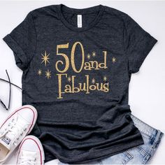 a t - shirt with the words 50 and fabulous on it next to some shoes