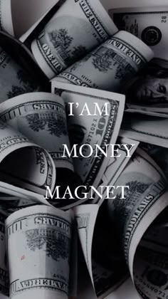 a pile of money with the words i'm money magnet on top of it