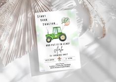 a green tractor birthday party card on a white background with palm fronds in the foreground