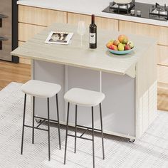 two stools sit at the counter in front of a bowl of fruit and wine