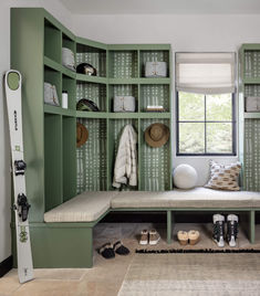 a room with green shelves and shoes on the floor