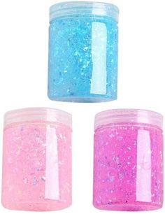 three jars filled with pink and blue glitter