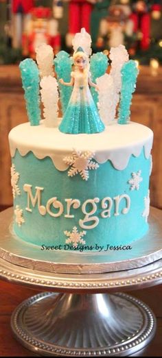 a frozen princess cake with frosting on top