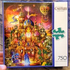 a puzzle box with an image of a castle in the sky and people on it