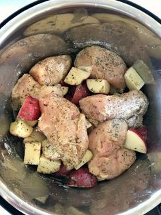 chicken, potatoes and carrots in an instant pressure cooker with seasoning on top