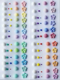 an assortment of different colored candies arranged on a white surface with flowers and dots