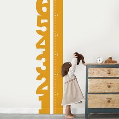 Not just any growth chart, this growth chart has a strip of white vinyl down the middle so that you can mark the progress of your child's growth. Use a marker or a sharpie and track your child's growth! Color: Orange | Zoomie Kids Numbers Growth Chart Decal Vinyl in Orange | 72 H x 17 W in | Wayfair | Home Decor Kids Numbers, Mini Room, Wall Growth Chart, Kids Growth Chart, Tree Decals, Number Wall, Numbers For Kids, Height Chart, Playroom Ideas