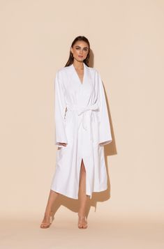 This luxurious Hotel single layer long robe in white is a must-have, whether lounging by the pool, relaxing at home, indulging in a spa day, or on vacation. The ultra-soft microfiber gives off ultra luxe vibes. Machine washable for ease of care. Elegant Summer Robe For Relaxation, Elegant White Robe For Relaxation, White Summer Robe For Relaxation, Elegant White Lounging Robe, Elegant White Sleepwear For Relaxation, White Spring Robe For Relaxation, Spring White Robe For Relaxation, Elegant White Beach Robe, Long White Robe For Daywear