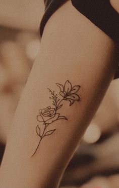 a woman's arm with a tattoo on it and a heart in the background