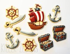 decorated cookies are arranged in the shape of pirate ships