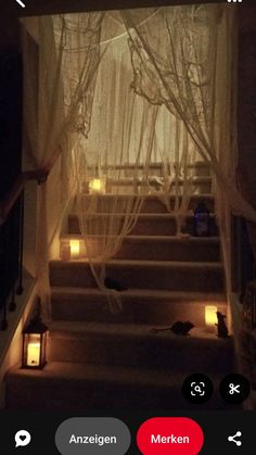 the stairs are lit up with candles and curtains