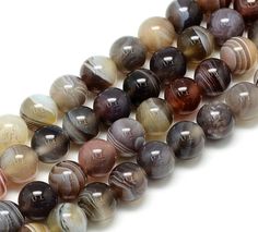 multicolored agate stone beads on white background