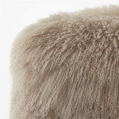 the back side of a sheep's fur pillow