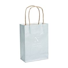 a white paper bag with rope handles