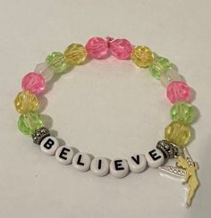 Embrace the power of belief with our handmade 'BELIEVE' beaded bracelet, featuring a delicate fairy charm. Each bead is meticulously chosen to create a harmonious blend of colors, symbolizing hope, magic, and the strength of believing in oneself. Fairy Bracelet, Power Of Belief, Fairy Bracelets, Radiate Positive Vibes, The Power Of Belief, Handcrafted Beaded Jewelry, Hope Bracelet, Fairy Charms, Inspirational Jewelry