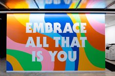 an advertisement on the side of a building that says, embrace all that is you