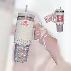 a hand holding a coffee cup with pink and silver glitters on it, next to an insulated thermos