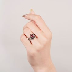 Enchanted Mystery: The Desi Black Gold Ring Set. This handcrafted set features a captivating 1.0-carat garnet, its fiery heart glowing against the backdrop of black gold vermeil. A timeless design with a touch of magic for any outfit (sizes 3.75-14.25). ✦ DETAILS ✦✧ Handcrafted ✧ 0.75 Carat center stone✧ Garnet and crystals ✧ Sizes 3.75-14.25 Black Ring Set, Gold Leaf Ring, Gold Leaf Rings, January Birthstone Jewelry, Garnet Engagement Ring, Black Gold Ring, Timeless Ring, Black Ring, Garnet Jewelry