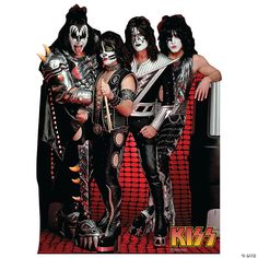 the kiss band posing for a photo in their costumes