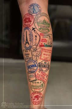 a man's leg with many different stamps on it