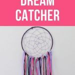 a pink and white poster with the words dream catcher on it