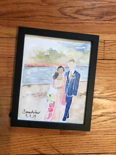 a watercolor painting of a bride and groom on a wooden floor next to the ocean