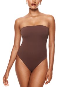 PRICES MAY VARY. Natrelax Collection - Crafted from soft and elastic fabrics, offering a second-skin feel and a smoothing effect, ensuring ultimate comfort Non-Slip strapless design provides a tight fit without slipping Double-layer fabric for not see-through and supportive fit. You can wear it even without a bra 4-way stretch fabric and bodycon design create a figure-hugging fit Thong-cut bottom for seamless wear, snap closures for easy on/off Perfect casual bodysuit for everyday wear, going ou Bodycon Design, Strapless Bodysuit, Kim K Style, Casual Bodysuit, 4 Way Stretch Fabric, Baddie Outfits, College Outfits, Amazon Women, Body Suit