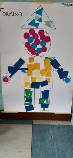 a paper doll made to look like a child's drawing on a white board