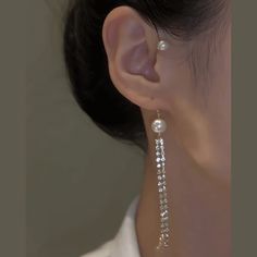 ✦ Add a touch of elegance to any occasion with our Pearl Tassel Fringe Ear Wrap Climber Crawler Earrings. These feminine earrings feature a sparkling rhinestone dangle and a stunning pearl tassel fringe. Perfect for weddings, prom, or as a bridesmaid gift. Even if you don't have pierced ears, you can still achieve a radiant and luxurious look with these earrings. Elevate your style with these simple yet glamorous accessories. ----------- DETAILS ----------- *Sold in Single. - Color: Gold - Optio Crawler Earrings, Feminine Earrings, Crawlers Earrings, Tassel Fringe, Pierced Ears, Bridesmaid Gift, Ear Piercings, Bridesmaid Gifts, Faux Pearl