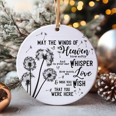 a christmas ornament with a dandelion saying may the winds of heaven whisper love and miss you wish