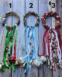 three different types of bracelets with bells attached to them on a wooden surface,