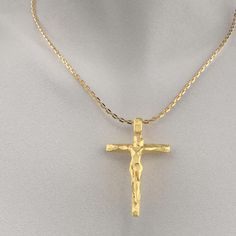 Italian Crucifix Necklace in 18k or 14k Gold. This modern crucifix necklace is a beautiful and elegant way to express your faith. The crucifix is made of genuine 18k or 14k gold and features a stylized design with a facetted surface. The cross is optionally suspended from a sturdy Forzatina chain made of solid gold. 14k or 18k Gold Pendant width: 30 Millimeters, Pendant height: 46 Millimeters Handmade in Italy Luxury Crucifix Cross Necklace For Formal Occasions, Luxury Gold Crucifix Cross Necklace, Gold Crucifix Cross Necklace For Formal Occasions, Gold Crucifix Cross Necklace With Polished Finish, Gold Crucifix Necklace With Polished Finish, Formal Crucifix Necklace With Polished Finish, Formal Yellow Gold Crucifix Necklace, Formal Yellow Gold Crucifix Cross Necklace, Yellow Gold Crucifix Cross Necklace For Formal Occasions