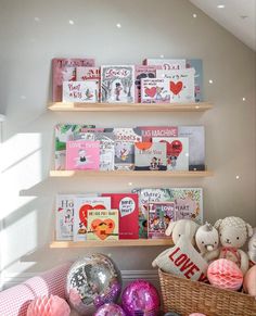 there are many books on the shelves in this children's bookcase and toys