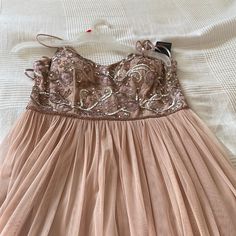 Gorgeous, Hand-Beaded Gown With A Beautiful Bodice. Embroidered Florals And A Lining Of Beads At The Waist, Delicate Spaghetti Straps And The Bodice Has Built In Support. No Bra Needed, Generous Pleated Tulle In Blush And Yes This Down Is Lined. Fairy Tales Do Come True In Tanks Gown. Brand New With Tags. See Photos And Videos. Lovely With Strappy Heels, Etc. Adrianna Papell Is Well-Known For Her Gowns, Made In India By The Finest Artisans, Quality Materials. Tags: Breakfast At Tiffany’s; Fairyt Sleeveless Tulle Dress With Beaded Straps, Tulle Dress With Beaded Straps And Sweetheart Neckline, Elegant Tulle Dress With Beaded Straps, Party Dresses With Beaded Straps And Tulle, Prom Season Dress With Beaded Straps, Embellished Tulle Gown For Bridesmaid, Embellished Tulle Bridesmaid Gown, Tulle Wedding Dress With Beaded Straps, Spring Wedding Dress With Beaded Straps