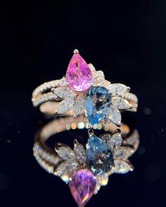 "This ring features a (8x8mm 8x8mm pear cut lab Made Aquamarine and pink sapphire). It is made by hand, and it will take about 6 to 8 days to finish the ring after your payment is completed. Main stone: 8x8mm 8x8mm Cut Type: pear cut Main stone: Lab Aquamarine and pink sapphire  Material: 925 sterling silver/rose gold/white gold/yellow gold Accent stone: american diamond Payment Policy We accept payment through PayPal only. We have selected PayPal because it is the safest and most reliable mode of payment which enables to rapid shipping to our buyers and protects their interests. Feedback Policy Please do not leave the Negative feedback or Natural feedback before giving us a chan to resolve your problems. Positive feedback will be automatic to leave for you when you give me Positive feedba Two Stone Ring, Pink Sapphire Ring, Aquamarine Ring, Wedding Anniversary Gift, Aquamarine Rings, Stone Engagement Rings, American Diamond, Anniversary Gift For Her, Ring Engagement