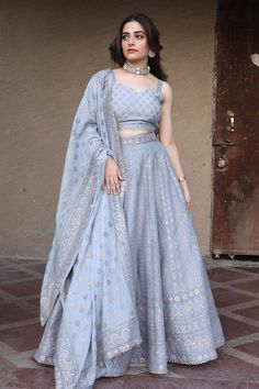 Cool grey chikankari lehenga featuring alternate paisley pattern with floral motifs on the kalis. Paired with a fitted padded blouse and a scalloped gota border dupatta.
Component: 3
Pattern: Woven
Type Of Work: Chikankari
Neckline: Sweetheart
Sleeve Type: Sleeveless
Fabric: Vegan Silk
Color: Grey
Other Details: 
21 kalis lehenga
Circles, paisley, mandala motifs on lehenga border
Occasion: Mehendi and Haldi - Aza Fashions Simple Lehnga Choli, Simple Lehenga Designs, Trendy Lehenga Designs, Lehenga Simple, Pastel Color Dress, Chikankari Lehenga, Simple Lehenga, Half Saree Lehenga, Wedding Lehenga Designs