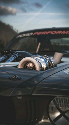 the front end of a black sports car