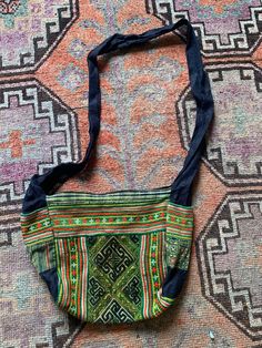 Handmade and hand-dyed shoulder bag/purse from Vietnam. It has intricately embroidered vintage details and natural indigo dyed straps and details. Very unique. Got on a trip to Sapa in Vietnam. Vintage Blue Embroidered Bag, Hand-stitched Bohemian Crossbody Shoulder Bag, Bohemian Hand-stitched Crossbody Shoulder Bag, Vintage Embroidered Bags For Festivals, Blue Bohemian Shoulder Bag For Market, Bohemian Blue Shoulder Bag For Market, Traditional Blue Handwoven Shoulder Bag, Vintage Embroidered Shoulder Bag For Festivals, Traditional Hobo Bag With Adjustable Strap For Daily Use