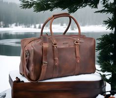 %100 Genuine Leather - Best Quality Oil-Tanned Full Grain Cowhide Leather A tough premium duffel bag for every travel purpose. It has a very beautiful and unique design, 100% handmade, leaving behind all the negatives of mass production. The Woven Leather Duffle is made from the finest quality leather that develops a beautiful patina over time, adding to the character and uniqueness of the bag. These bags are both durable and elegant, able to withstand the rigors of travel while exuding a sense Luxury Waxed Finish Duffle Bag, Luxury Rectangular Duffle Bag With Waxed Finish, Luxury Rectangular Weekender Bag With Waxed Finish, Luxury Waxed Finish Rectangular Weekender Bag, Brown Leather Travel Bag For Gift, Brown Leather Travel Bag As Gift, Brown Leather Travel Bag Gift, Leather Travel Bag As A Gift, Leather Travel Bag With Luggage Sleeve As Gift