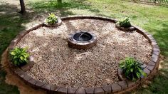 a fire pit in the middle of a yard