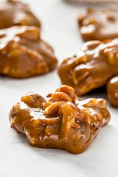 some cookies are covered in caramel and drizzled with icing