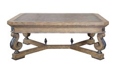 a wooden table with metal legs and an ornate design on the top, against a white background