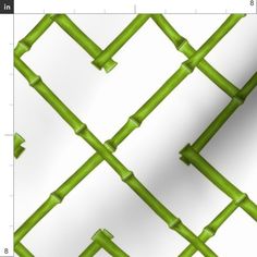 an abstract pattern made up of green bamboo sticks and white paper with squares on it