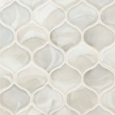 an abstract white tile pattern with wavy lines