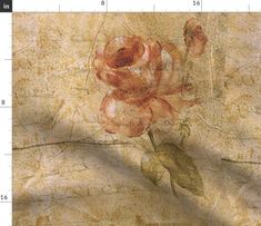 a drawing of a rose on a piece of paper with a ruler in front of it