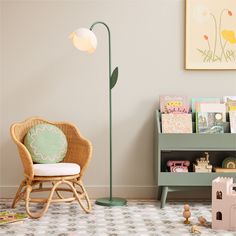 a child's room with a chair, book shelf and toys on the floor