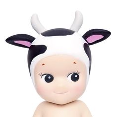 a small toy cow with horns on it's head