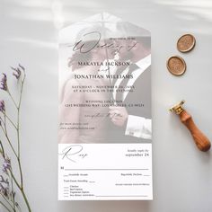 the wedding card is next to some money